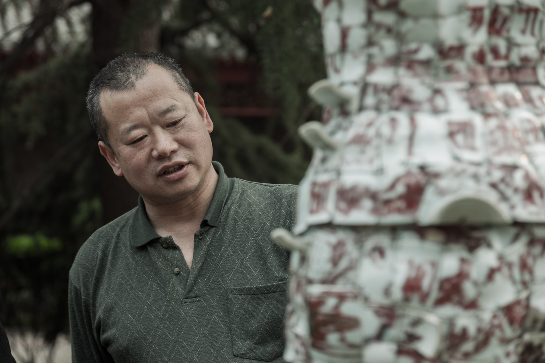 Li Xiaofeng installing his sculpture in the Luxembourg Ambassador's garden. Have arranged to visit his studio in spring.